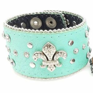 Turquoise leather cuff.